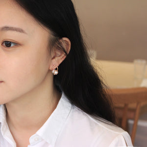 TWISTED SILVER HOOP EARRINGS